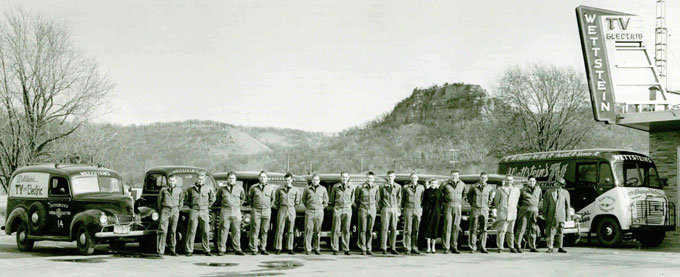 vintage photo of wettstein electric trucks and employees